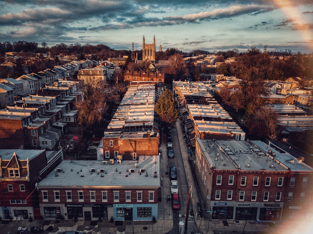 Photo by Edan Cohen aerial view of brown concrete buildings